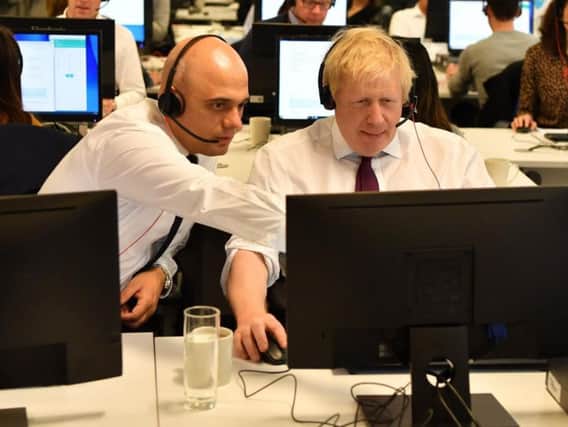 Former Chancellor Sajid Javid and Prime Minister Boris Johnson during the election campaign