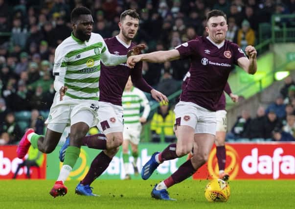 John Souttar, right, says Hearts cannot afford to dwell on their midweek defeat by Celtic as they prepare to face fellow Premiership strugglers Hamilton and St Mirren in the next seven days. Picture: Alan Harvey/SNS