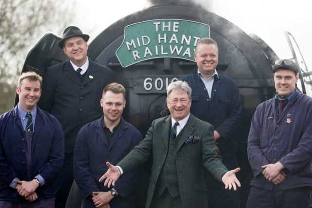 Alan Titchmarsh poses for a photograph with the crew of the Flying Scotsman, after it arrived at Alton station in Hampshire to officially re-open the Mid Hants Railway's Watercress Line picture: PA