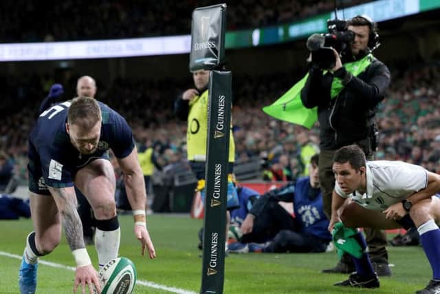 Scotland's full-back Stuart Hogg fumbles the ball against Ireland and drops it before claiming the try, which was subsequently denied after a review.
