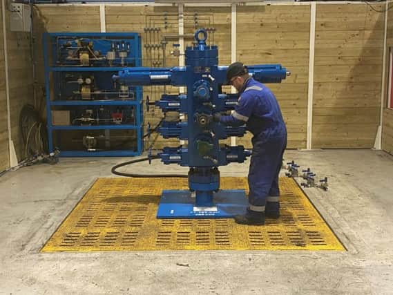 RMEC's Lee Alexander setting up client-owned equipment for hydrostatic testing at the firms new test bay. Picture: Contributed
