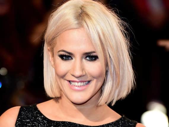 Caroline Flack's boyfriend Lewis Burton has said that his "heart is broken" following the death of the TV presenter. Picture: PA