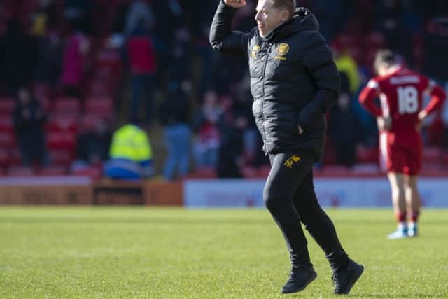 Manager Neil Lennon is jubilant as the final whistle sounds on Celtic's 2-1 victory at Pittodrie.