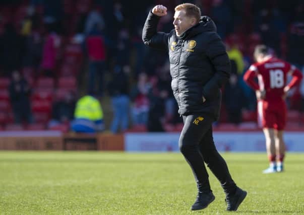 Manager Neil Lennon is jubilant as the final whistle sounds on Celtic's 2-1 victory at Pittodrie.