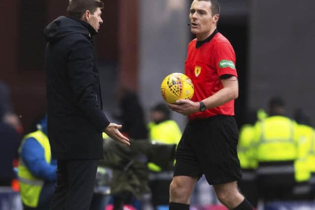Steven Gerrard confronts referee Euan Anderson at full-time at Ibrox yesterday. Picture: SNS