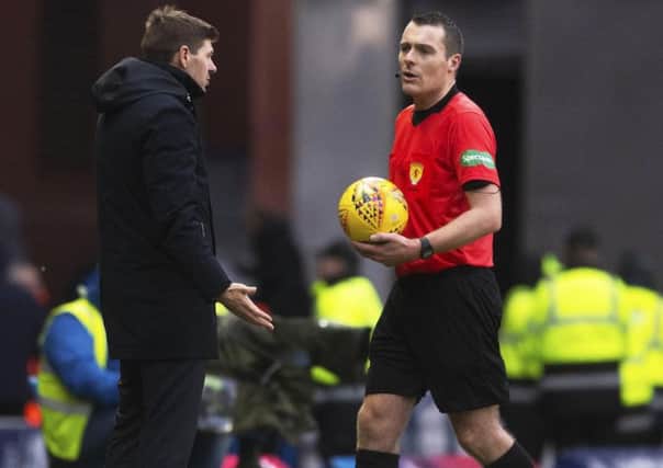 Steven Gerrard confronts referee Euan Anderson at full-time at Ibrox yesterday. Picture: SNS