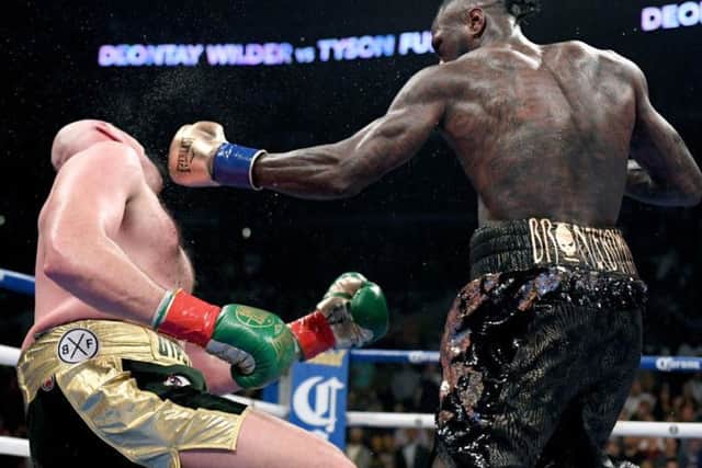 Fury seemed down for the count after Wilder floored him in the final round of their last bout. Picture: Harry How/Getty Images