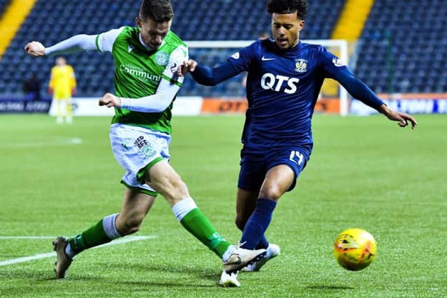 Hibernian defender Paul McGinn, left, challenges for the ball with Niko Hamalainen during the Easter Road sides win at Rugby Park. Picture: Rob Casey/SNS
