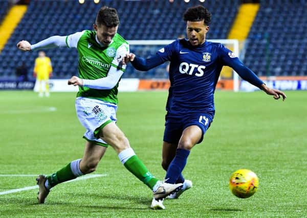 Hibernian defender Paul McGinn, left, challenges for the ball with Niko Hamalainen during the Easter Road sides win at Rugby Park. Picture: Rob Casey/SNS