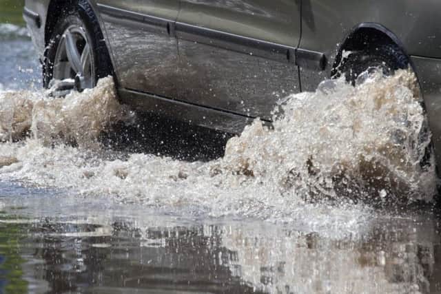 Storm Dennis brought wet and windy weather to the UK over the weekend, with some roads still flooded after torrential rain.