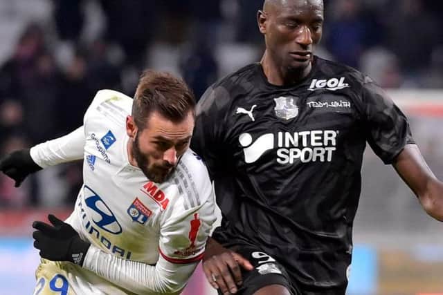 Serhou Guirassy (right) in action against Olympique Lyonnais