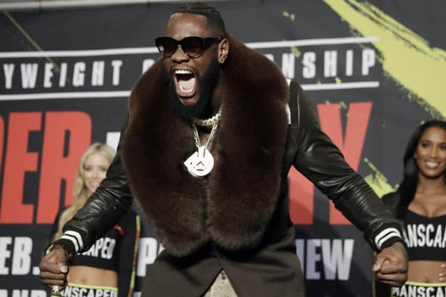 Flamboyant in his fur-trimmed overcoat, Deontay Wilder arrives for a meeting with the media ahead of his fight with Tyson Fury. Picture: AP.