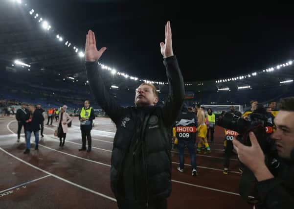 Celtic manager Neil Lennon hails the travelling Celtic fans after a late goal by Olivier Ntcham silenced the Lazio supporters in the Stadio Olimpico. Picture: Paolo Bruno/Getty