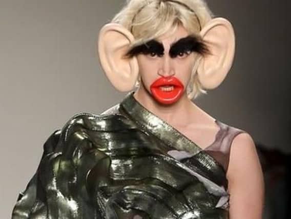 According to the BBC, models in New York were asked to wear fake ears, lips and busy eyebrows in the student show.