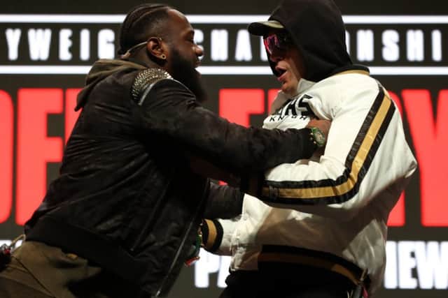 Deontay Wilder and Tyson Fury confront each other on stage during the press conference at the MGM Grand Garden Arena ahead of Saturdays world title fight. Picture: PA.
