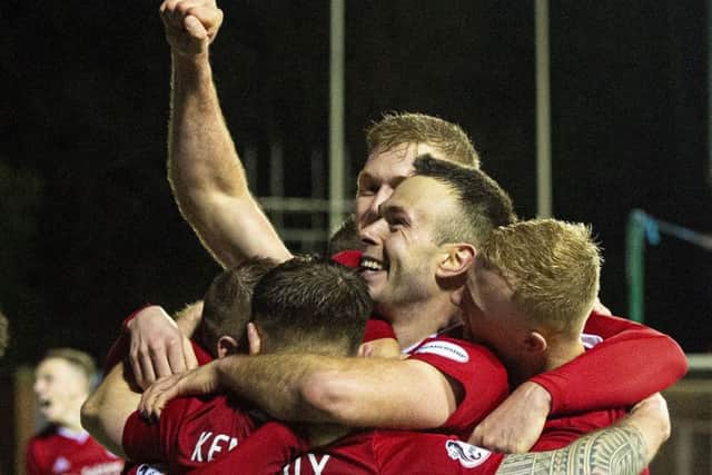 Andrew Considine leads the celebrations at Kilmarnock. Picture: Ross MacDonald/SNS