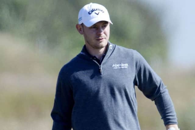 11/07/14 ABERDEEN ASSET MANAGEMENT SCOTTISH OPEN
ROYAL ABERDEEN GOLF CLUB
Scott Henry searches for his ball