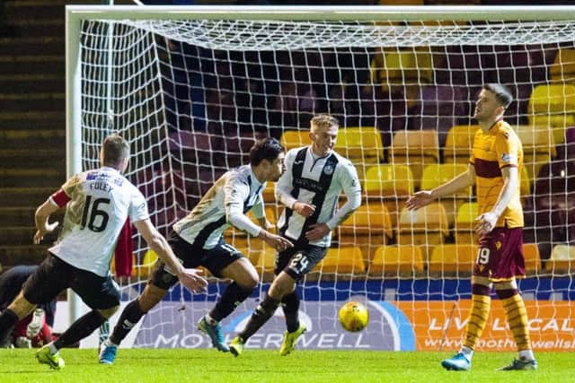 Ilkay Durmus wheels away in delight after making it 2-1 to St Mirren at Fir Park. Picture: Ross MacDonald/SNS