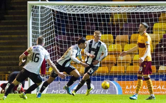 Ilkay Durmus wheels away in delight after making it 2-1 to St Mirren at Fir Park. Picture: Ross MacDonald/SNS