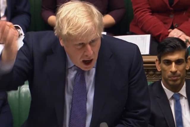 Boris Johnson and new Chancellor Rishi Sunak in the House of Commons (Picture: AFP via Getty Images)