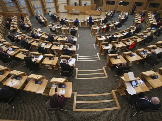 MSPs social distancing with every second seat removed at the Scottish Parliament at Holyrood. Emma Walker had been seeking to run for the Scottish Liberal Democrats at next year's Holyrood elections