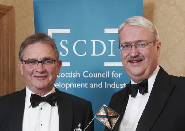 Brian Wilson, Chairman of Harris Tweed Hebrides with Michael Urquhart, Chairman SCDI Highlands & Islands Committee.