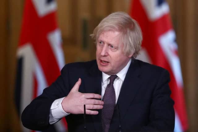Boris Johnson plays down calls for easing of restrictions - and refuses to comment on royal controversy (Photo by HANNAH MCKAY/POOL/AFP via Getty Images)
